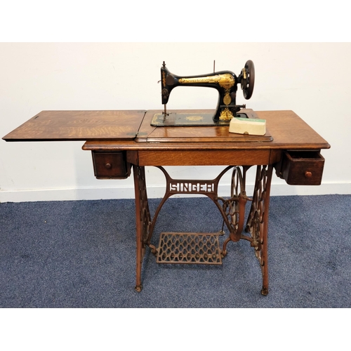 668 - VICTORIAN SINGER SEWING MACHINE AND TREADLE TABLE
sewing machine numbered 11285616, decorated with S... 