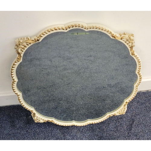 714 - CIRCULAR PEERART WALL MIRROR
the bevel edged mirror in ornate cream and gilt frame, 59 x 59cm