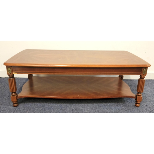 721 - CONTEMPORARY TEAK LOUNGE TABLE
The legs fluted with oval brass cartouches above, with undertier, 121... 