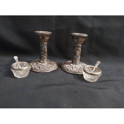 255 - PAIR OF SILVER CANDLESTICKS 
Birmingham , decorated with raised birds and foliage, 10cm high (filled... 