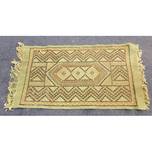 HANDWOVEN WOOLEN MIDDLE EASTERN PRAYER RUG
on green ground with fringing, 71 x 126cm