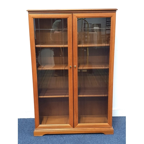 710 - LEGATE MID-CENTURY STYLE GLAZED FRONT DISPLAY CABINET
with two doors opening to reveal a spacious th... 