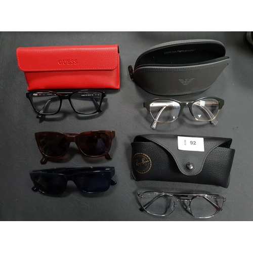 92 - THREE PAIRS OF DESIGNER GLASSES
comprising Emporio Armani, Ray-Ban and Guess (all in cases); togethe... 