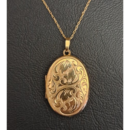 44 - NINE CARTAT GOLD LOCKET PENDANT
the oval locket with scroll engraved decoration, on nine carat gold ... 