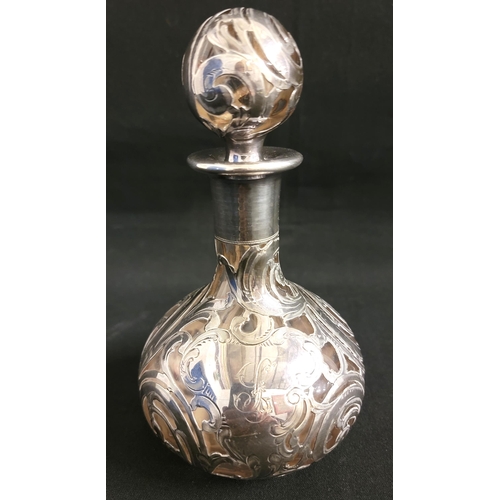 203 - AMERICAN ART NOVEAU SILVER ALVIN PERFUME BOTTLE AND STOPPER
decorated with silver overlay swirls ove... 