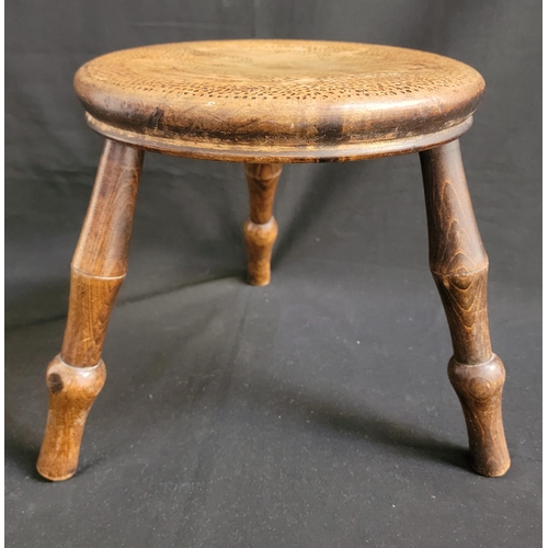 VICTORIAN FOLK ART OAK MILK STOOL
with poker work detailing to the top of the seat depicting an eagle, raised on three turned legs, 28cm diameter and 28cm high