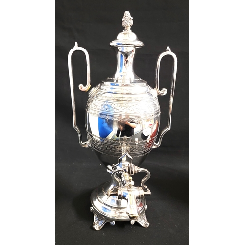 215 - SILVER PLATED TEA URN BY JOHN DEAKIN & SONS
the cover with foliate finial, with twin handles and gra... 