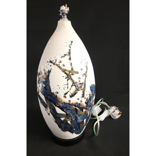 238 - JAPANESE CERAMIC TABLE LAMP
with textured body and various glazes with branches and blossom, signed ... 