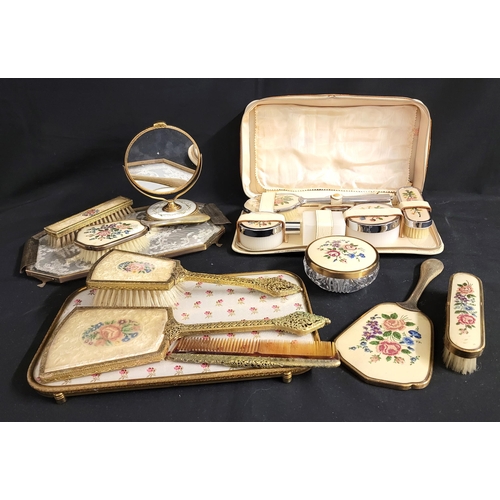 384 - SELECTION OF VINTAGE PETIT POINT VANITY SETS
consisting of five piece set with gilt edging, another ... 