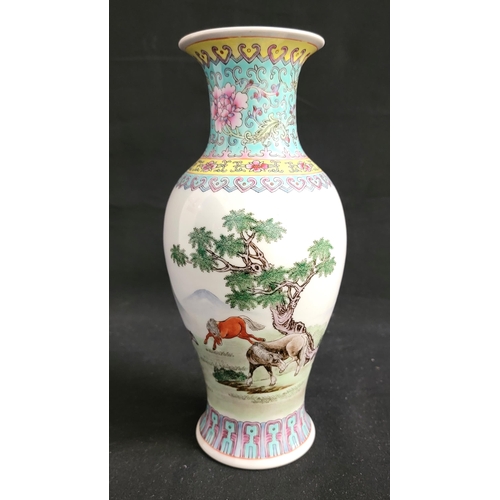 241 - 20th CENTURY CHINESE VASE
with pink, yellow and turquoise decoration to top and base, the body depic... 