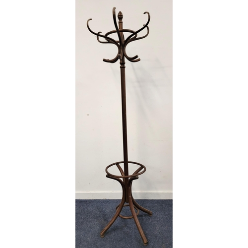 656 - BENTWOOD HAT/COAT STAND
with six arms, a circular umbrella holding band and raised on four legs, 196... 