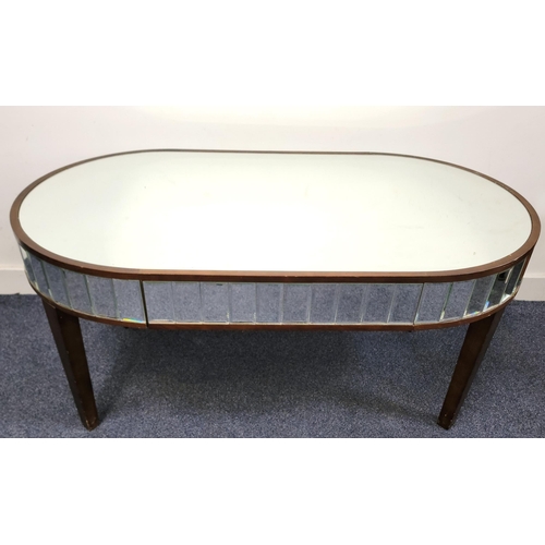 667 - MIRRORED AND WALNUT EFFECT COFFEE TABLE
the mirrored top above a segmented mirrored band, the top 11... 