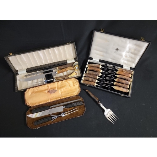 217 - THREE VINTAGE CASED ANTLER HORN FLATWARE SETS
consisting of Mappin and Webb Antler horn handled six ... 