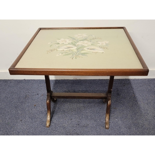 659 - MAHOGANY FRAMED FOLDING FIRE SCREEN/ OCCASIONAL TABLE
the embroidered panel depicting lilies, the pa... 