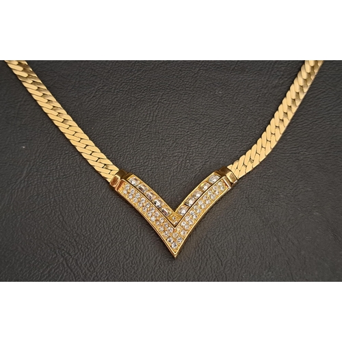 61 - VINTAGE CHRISTIAN DIOR NECKLACE
the paste set triangular arrow section flanked by gilt neck chain