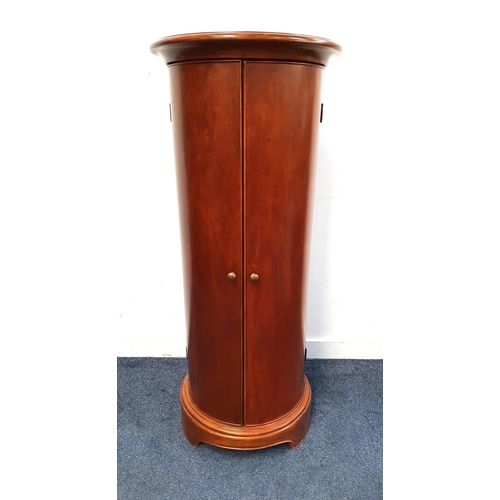 708 - CONTEMPORARY PILLAR BOX STYLE MAHOGANY CUPBOARD
with curved doors, the interior with shelving and ba... 