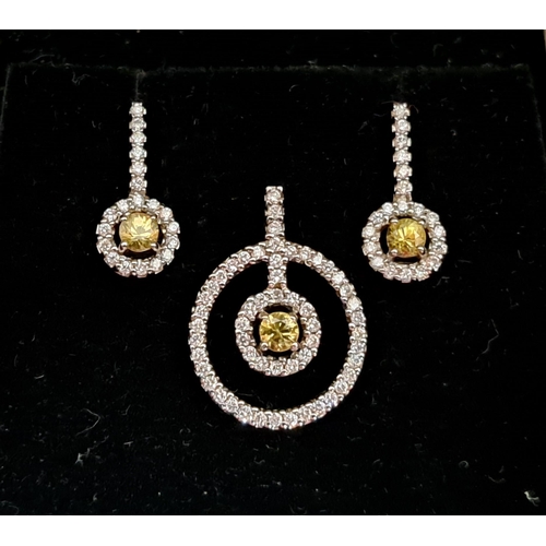 58 - ATTRACTIVE YELLOW AND WHITE DIAMOND SUITE OF EIGHTEEN CARAT WHITE GOLD JEWELLERY
comprising a pendan... 