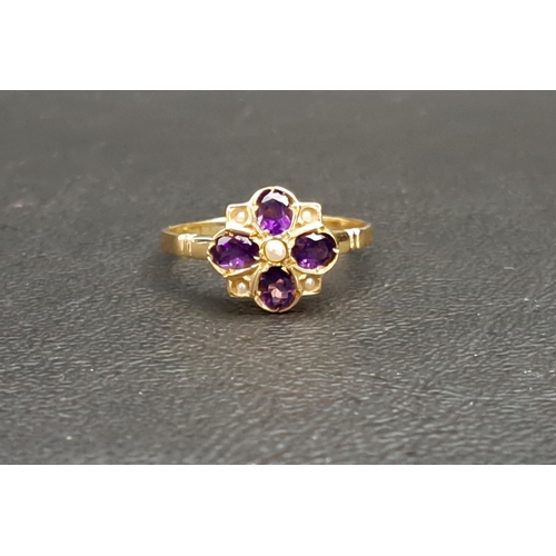 73 - AMETHYST AND SEED PEARL CLUSTER RING
the four oval cut amethysts interspersed with seed pearls, on n... 