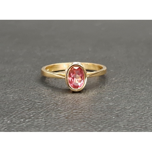 83 - PINK TOPAZ SINGLE STONE RING
the bezel set oval cut pink topaz approximately 0.7cts, on nine carat g... 