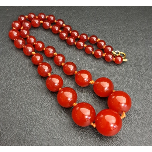 143 - GRADUATED CHERRY AMBER BEAD NECKLACE
the largest bead approximately 15.1mm diameter, the necklace 49... 