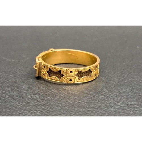 152 - VICTORIAN FIFTEEN CARAT GOLD BUCKLE DESIGN MOURNING RING
the band with black enamel, seed pearls and... 