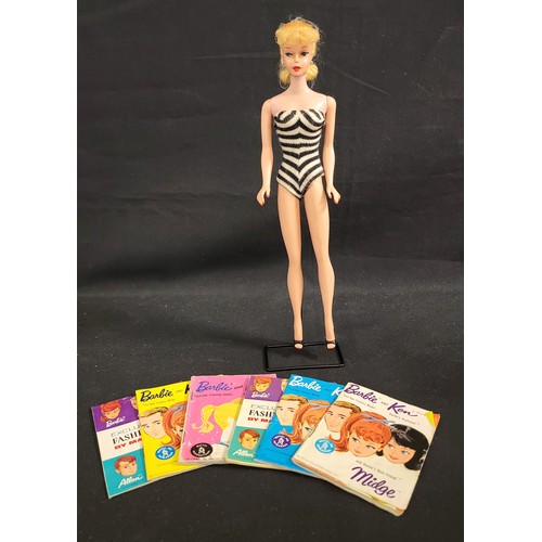 459 - 1960s ORIGINAL SWIMSUIT BARBIE
in black and white swimsuit with blue eyeshadow and pony tail on stan... 