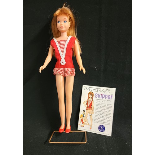 460 - 1960s VINTAGE SKIPPER DOLL WITH AUBURN HAIR
with red short jumpsuit and red plastic shoes and stand,... 