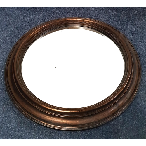 728 - LARGE ROUND WALL MIRROR 
the wooden frame with metallic bronze finish, the mirror with bevel edge, t... 