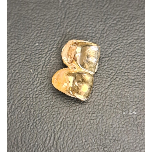 198 - TWO GOLD TOOTH CROWNS
still attached to teeth, total weight 3 grams