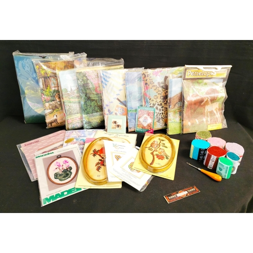 LARGE QUANTITY OF EMBROIDERY AND NEEDLECRAFT KITS AND ACCESSORIES
including frames, hoops, un-opened craft collection kits, two boxes of rug wool and rug making kits, etc.