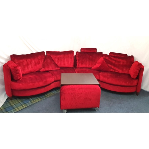 TWO CONTEMPORARY SPANISH CURVED MODULAR SOFAS AND POUFFE BY FAMA
covered in rich red textured velvet with matching cushions, each of the two sections measuring 200 x 99 x 100cm each; the matching pouffe on wheels with fitted detachable dark wooden tray, 74 x 56 x 74cm (3)
Note: see next lot for matching pieces.