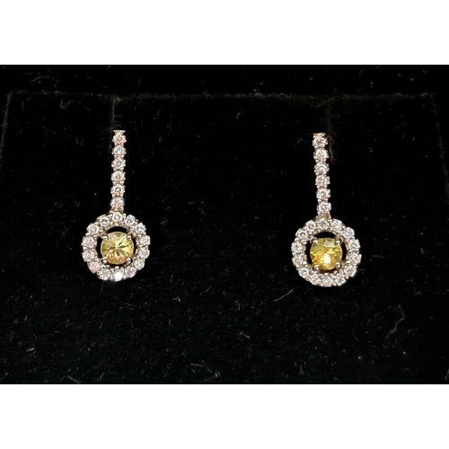 58 - ATTRACTIVE YELLOW AND WHITE DIAMOND SUITE OF EIGHTEEN CARAT WHITE GOLD JEWELLERY
comprising a pendan... 