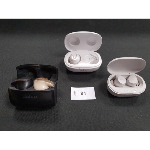 91 - TWO PAIRS OF EARBUDS IN CHARGING CASES
comprising Jabra and Philips; together with a single Rhox ear... 