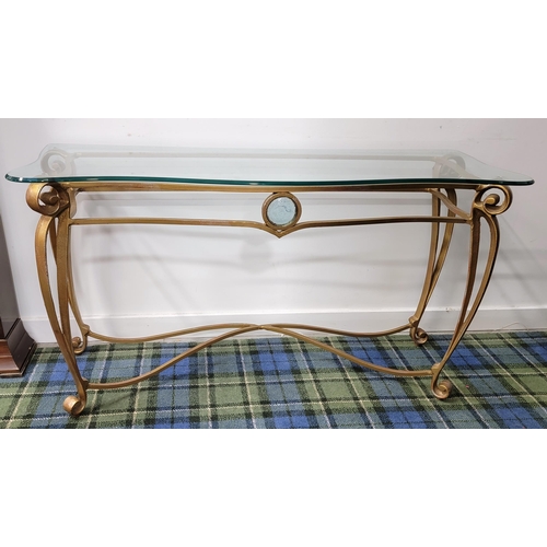 488 - GILT FINISHED WROUGHT IRON AND GLASS CONSOLE TABLE
the shaped glass top above gilt wrought iron base... 