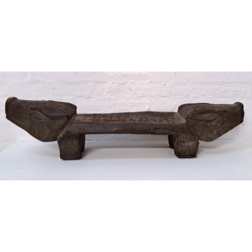 481 - FOLK ART HARDWOOD PIG BENCH / STOOL
with engraved pig heads to each side, atop two legs
122cm long, ... 