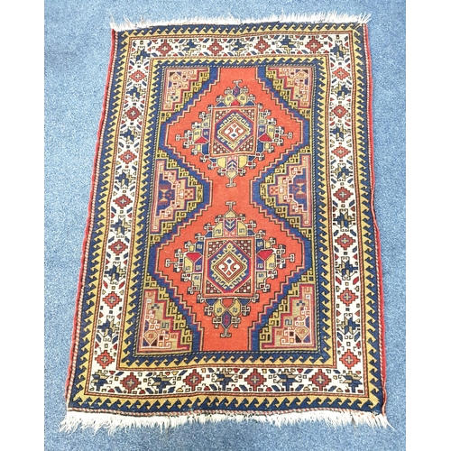 491 - TURKISH WOOLEN HAND KNOTTED RUG
 on red and blue ground, 104 x 148cm