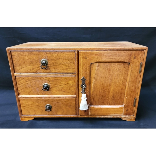 318 - 20th CENTURY OAK WORK BOX/ COLLECTORS CABINET
with three drawers, brass drop handles, and cupboard w... 