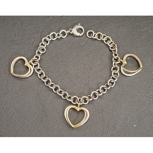 1 - FOURTEEN CARAT WHITE GOLD BRACELET
with three two tone gold heart charms, 18.5cm long and approximat... 