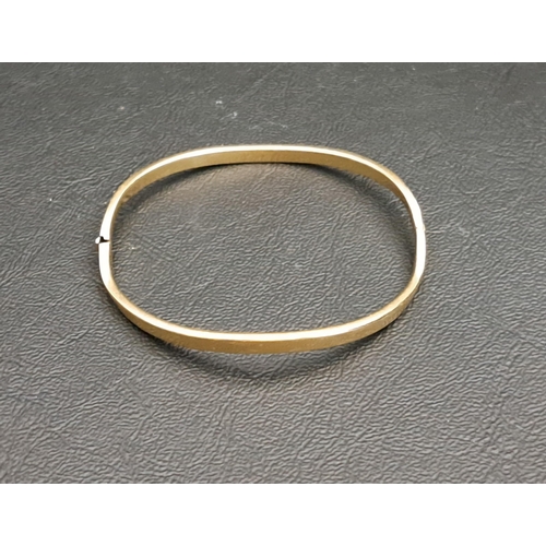 6 - NINE CARAT GOLD HINGED BANGLE
of wavy design, approximately 5.8 grams