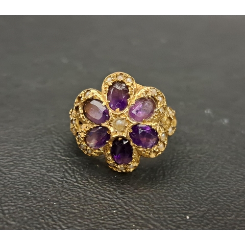 8 - AMETHYST AND SEED PEARL CLUSTER DRESS RING
the six oval cut amethysts surrounded by seed pearls, on ... 