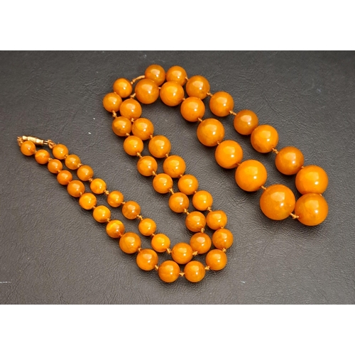 62 - GRADUATED BUTTERSCOTCH AMBER BEAD NECKLACE
all round beads, the largest approximately 17.1mm diamete... 