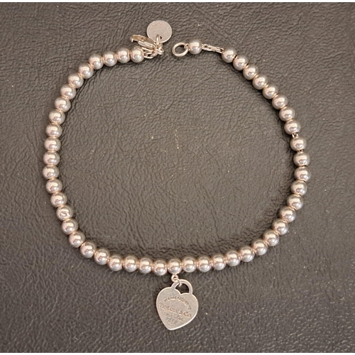 69 - TIFFANY & CO. SILVER HEART TAG BEAD BRACELET
19.5cm long (clasp damaged)