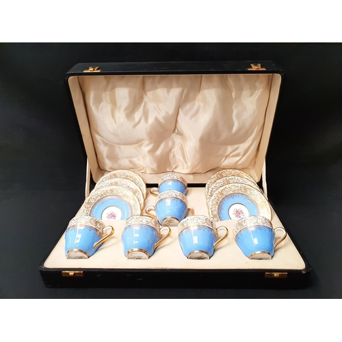 264 - CASED SPODE COPELANDS CHINA 'RUSKIN' COFFEE SET
all with gilt and floral decoration on light blue an... 