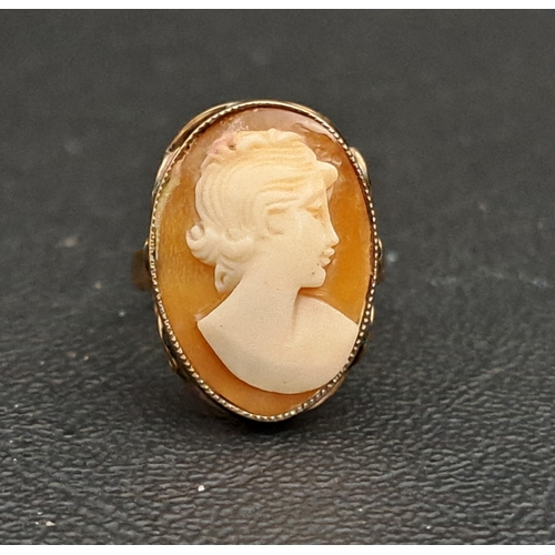 34 - CAMEO DRESS RING
the shell cameo depicting a female bust in profile, on ten carat gold shank, ring s... 