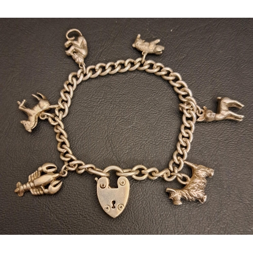 57 - SILVER CHARM BRACELET
the curb link bracelet with heart padlock clasp and six animal charms, total w... 