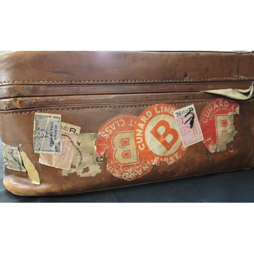 291 - LEATHER 'THE CLIPPER BAG' SUITCASE
with various Cunard Line stickers, including one for the Sylvalia... 