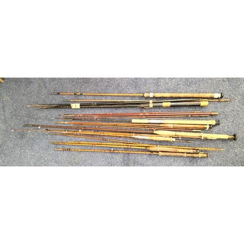 439 - ASSORTMENT OF VINTAGE FISHING RODS
including a three -piece cane rod stamped J B walker Newcastle on... 