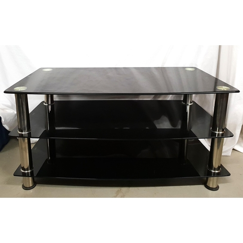 482 - THREE TIER BLACK GLASS MEDIA UNIT
with chromed tubular supports, 95cm x 48cm x 45cm