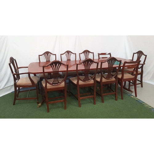 554 - REGENCY STYLE MAHOGANY DINING ROOM TABLE AND CHAIRS
with banded edge and raised on twin fluted pedes... 