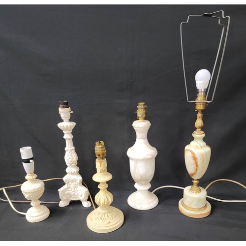 561 - FIVE VARIOUS TABLE LAMP BASES
comprising an onyx example, an alabaster lamp, two decorative resin la... 